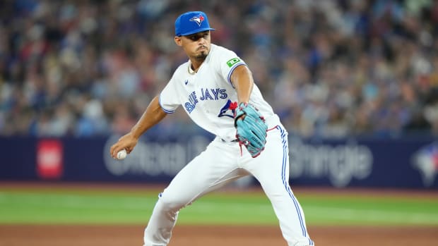 Aug 15, 2023; Toronto, Ontario, CAN; Toronto Blue Jays pitcher Jordan Hicks (12) pitches against the Philadelphia Phillies during the eighth inning at Rogers Centre. Mandatory Credit: John E. Sokolowski-USA TODAY Sports
