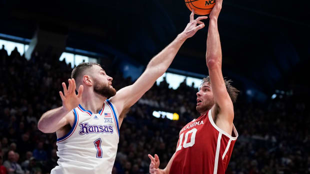 Jan 13, 2024; Lawrence, Kansas, USA; Kansas Jayhawks center Hunter Dickinson (1) blocks the shot of Oklahoma Sooners forward Sam Godwin (10) during the first half at Allen Fieldhouse. 