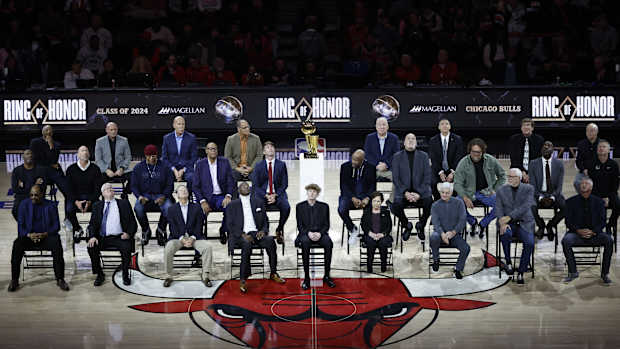 Chicago Bulls class of 2024 Ring of Honor inductees from left to right, (Back Row) Jim Cleamons, Erik Heiland, Ivika Duran, Clarence Gaines, Jr., John Ligmanowski, Chip Schaefer, Jim Stack, Al Vermeil (Middle Row) Randy Brown, Jud Buechler, Jason Coffey, James Edwards, Jack Haley, Jr., Ron Harper, Bill Wennington, Luc Longley, John Salley, Steve Kerr (Front Row) Artis Gilmore, Matt Kerr, Greg Klein, Bob Love, JJ Parrish, Thelma Krause, Chris Winter, Phil Jackson, Toni Kukoc are honored during the inaugural ceremony at halftime of a game between the Bulls and Golden State Warriors at United Center.