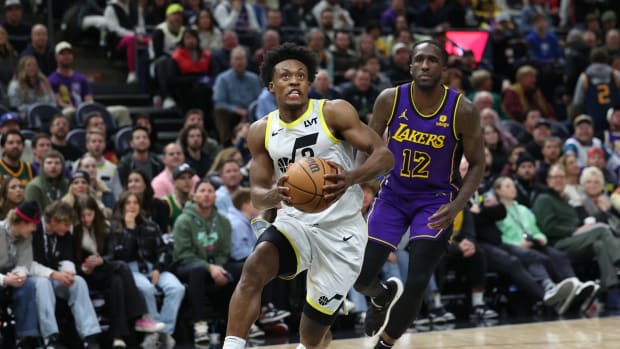 Jan 13, 2024; Salt Lake City, Utah, USA; Utah Jazz guard Collin Sexton (2) dribbles past Los Angeles Lakers forward Taurean Prince (12) during the fourth quarter at Delta Center.