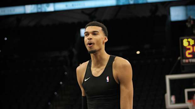 Jan 4, 2024; San Antonio, Texas, USA; San Antonio Spurs forward Victor Wembanyama (1) reacts during warmups prior to facing Giannis Antetokounmpo and the Milwaukee Bucks.
