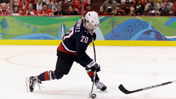 Natalie Darwitz fires a shot during the 2010 Olympics
