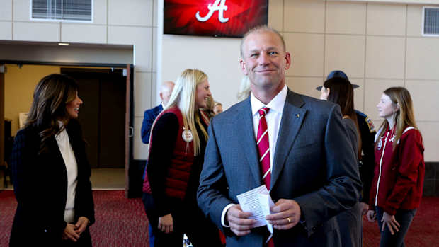 Kalen DeBoer smiles at his Alabama introductory press conference.