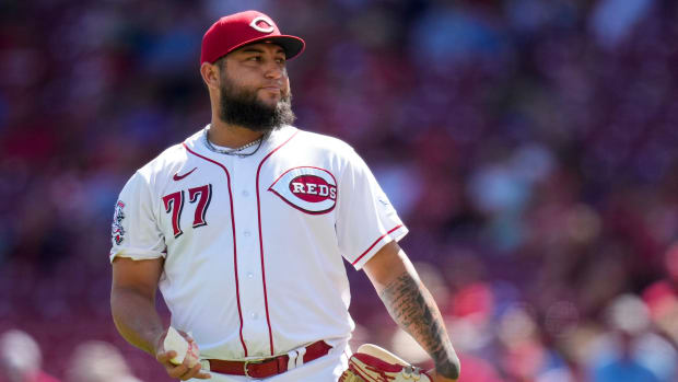 Cincinnati Reds relief pitcher Daniel Duarte (77) tosses a rosin bag and shakes his head after giving up a solo home run to Chicago Cubs right fielder Seiya Suzuki (27) in the eighth inning of an MLB National League game between the Cincinnati Reds and the Chicago Cubs at Great American Ball Park in downtown Cincinnati on Friday, Sept. 1, 2023. The Cubs won the first game of the doubleheader, 6-2. 