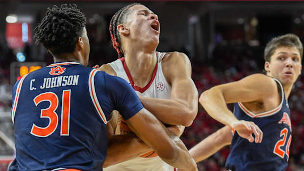 Razorbacks Trevon Brazile tries to draw foul against Auburn
