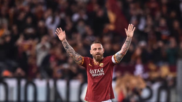 Daniele De Rossi pictured waving to fans at the end of his final appearance for Roma as a player in May 2019