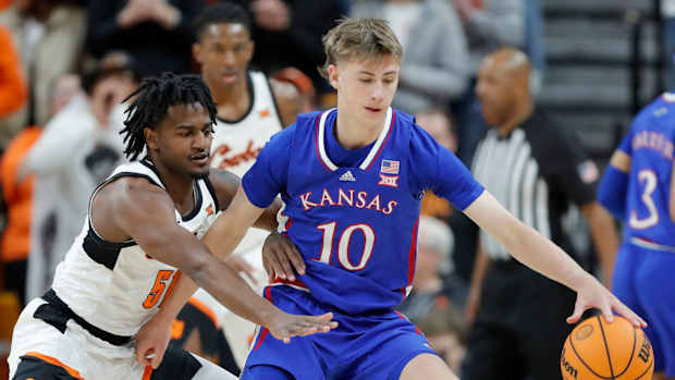 Oklahoma State Cowboys guard John-Michael Wright (51) defends Kansas Jayhawks guard Johnny Furphy (10) during a college basketball game between the Oklahoma State University Cowboys (OSU) and the Kansas Jayhawks at Gallagher-Iba Arena in Stillwater, Okla., Tuesday, Jan. 16, 2024.  