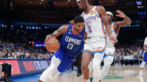 Oct 27, 2022; Oklahoma City, Oklahoma, USA; LA Clippers guard Paul George (13) drives against Oklahoma City Thunder guard Shai Gilgeous-Alexander (2) during the second half at Paycom Center. Oklahoma City won 118-110. Mandatory Credit: Alonzo Adams-USA TODAY Sports