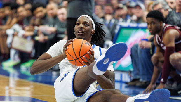 Jan 17, 2024; Lexington, Kentucky, USA; Kentucky Wildcats forward Aaron Bradshaw (2) goes to the floor after the ball during the first half against the Mississippi State Bulldogs at Rupp Arena at Central Bank Center. Mandatory Credit: Jordan Prather-USA TODAY Sports