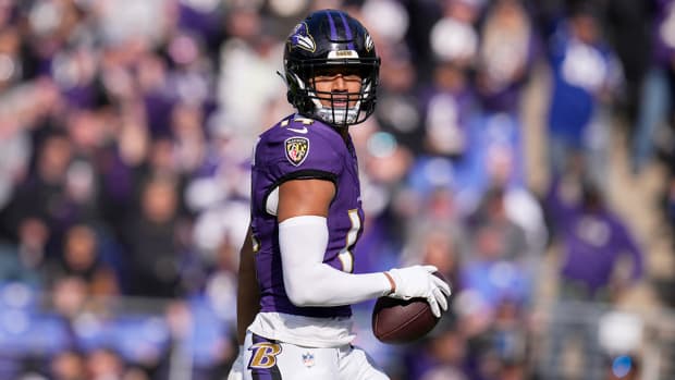 Kyle Hamilton holds the ball after scoring a touchdown for the Ravens