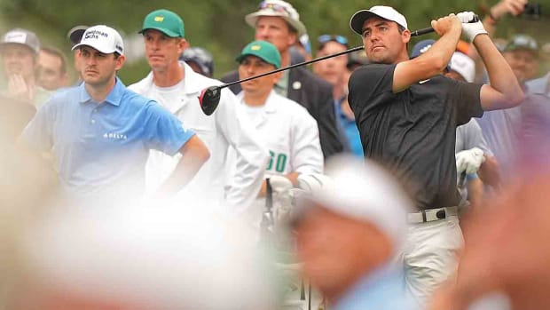 Scottie Scheffler watches a tee shot during practice at the 2023 Masters.