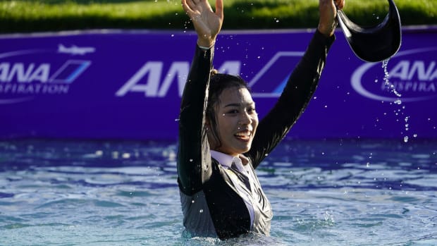 Patty Tavatanakit celebrates in Poppie's Pond after winning the 2021 ANA Inspiration.