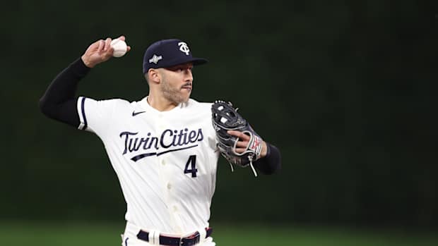 Carlos Correa fields a ground ball