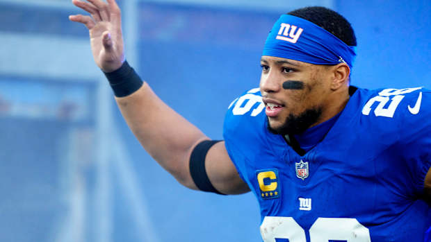 New York Giants running back Saquon Barkley (26) takes the field at MetLife Stadium on Sunday, January 7, 2024.