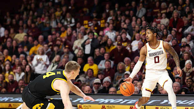Elijah Hawkins dribbles