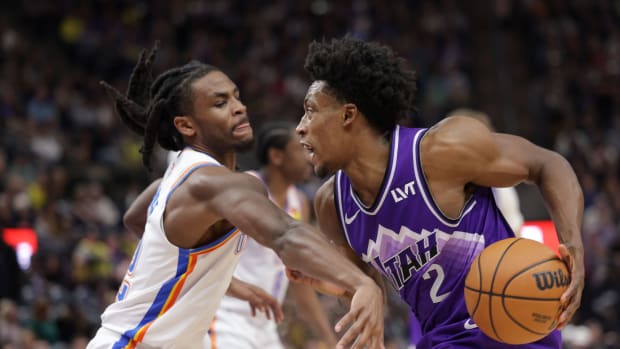 Jan 18, 2024; Salt Lake City, Utah, USA; Utah Jazz guard Collin Sexton (2) protects the ball from Oklahoma City Thunder guard Cason Wallace (22) during the second half at Delta Center.