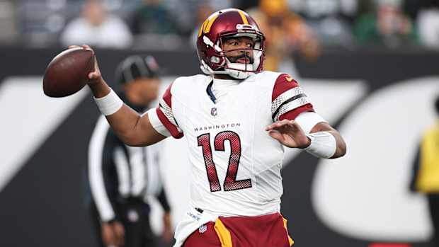 Washington Commanders quarterback Jacoby Brissett (12) throws the ball during the second half against the New York Jets at MetLife Stadium.