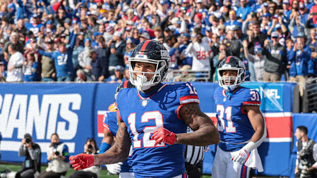 Oct 22, 2023; East Rutherford, New Jersey, USA; New York Giants tight end Darren Waller (12) celebrates his touchdown reception during the first half against the Washington Commanders at MetLife Stadium.