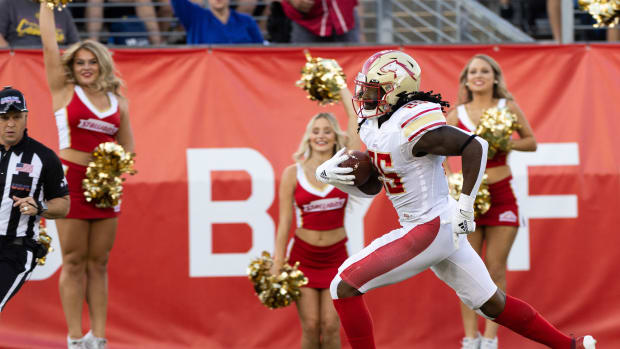 Jul 3, 2022; Canton, OH, USA; Birmingham Stallions running back Bo Scarbrough (25) runs the ball into the end zone for a touchdown against the Philadelphia Stars during the first quarter at Tom Benson Hall of Fame Stadium. Mandatory Credit: Scott Galvin-USA TODAY Sports  