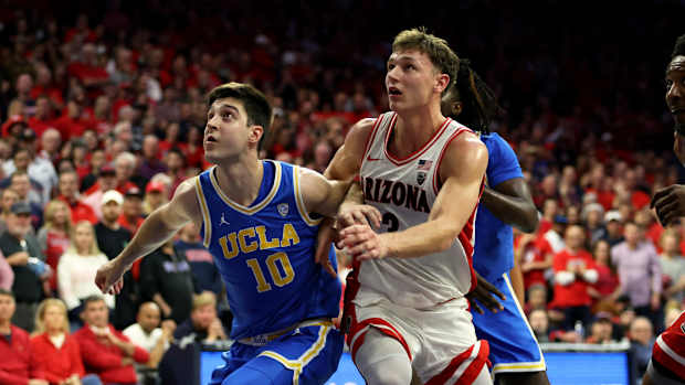 Arizona Wildcats guard Pelle Larsson (3) battles for position against UCLA Bruins guard Lazar Stefanovic (10) men's basketball