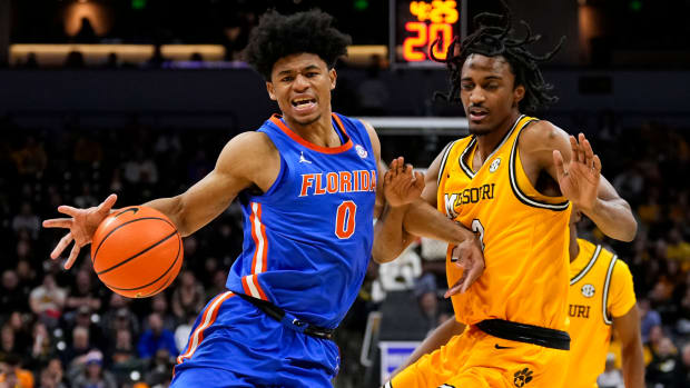 Jan 20, 2024; Columbia, Missouri, USA; Florida Gators guard Zyon Pullin (0) drives against Missouri Tigers forward Aidan Shaw (23) during the second half at Mizzou Arena.