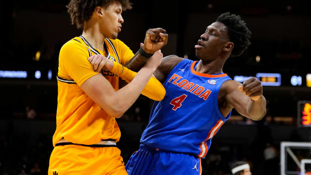 Missouri Tigers forward Jordan Butler (0) and Florida Gators forward Tyrese Samuel (4) get tangled up during the second half at Mizzou Arena.