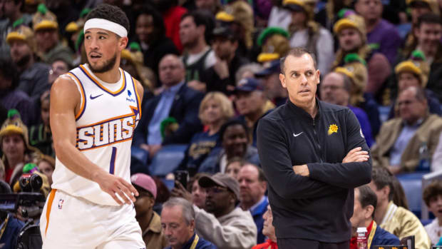 Phoenix Suns head coach Frank Vogel looks on as guard Devin Booker (1) walks past him against the New Orleans Pelicans during the first half at Smoothie King Center.