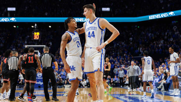 Jan 20, 2024; Lexington, Kentucky, USA; Kentucky Wildcats guard D.J. Wagner (21) congratulates forward Zvonimir Ivisic (44) during the first half against the Georgia Bulldogs at Rupp Arena at Central Bank Center. Mandatory Credit: Jordan Prather-USA TODAY Sports