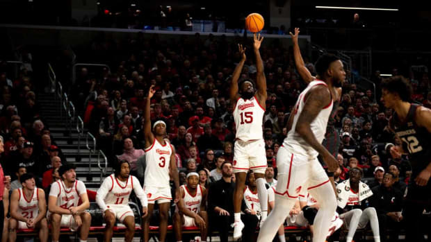 Cincinnati Bearcats guard John Newman III (15) hits a 3-point basket in the second half of the NCAA basketball game between Cincinnati Bearcats and Oklahoma Sooners at Fifth Third Arena in Cincinnati on Saturday, Jan. 20, 2024.
