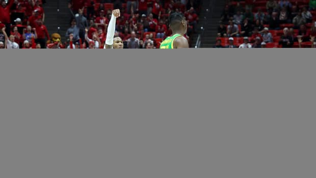 Jan 21, 2024; Salt Lake City, Utah, USA; Utah Utes guard Deivon Smith (5) holds his follow through after making a three point shot against the Oregon Ducks during the second half at Jon M. Huntsman Center. Mandatory Credit: Rob Gray-USA TODAY Sports