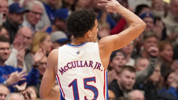 Jan 22, 2024; Lawrence, Kansas, USA; Kansas Jayhawks guard Kevin McCullar Jr. (15) celebrates against the Cincinnati Bearcats after making a three point shot during the first half at Allen Fieldhouse. Mandatory Credit: Denny Medley-USA TODAY Sports  