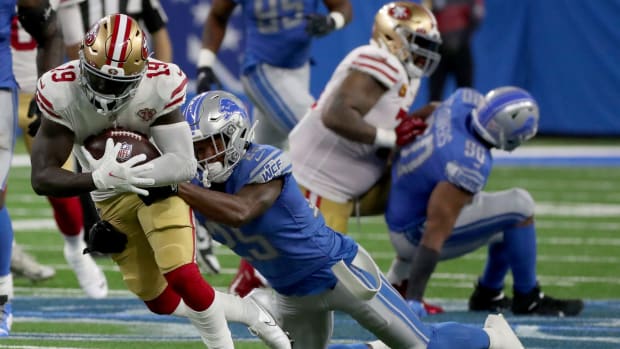 San Francisco 49ers receiver Deebo Samuel makes a catch against Detroit Lions defensive back Will Harris on Sunday, Sept. 12, 2021 at Ford Field.  