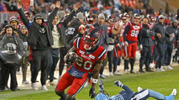 Nov 11, 2023; Toronto, Ontario, CAN; Montreal Alouettes running back Jeshrun Antwi (20) breaks a tackle attempt by Toronto Argonauts defensive back Mason Pierce (28) to score a touchdown in the second half at BMO Field. Mandatory Credit: Dan Hamilton-USA TODAY Sports  