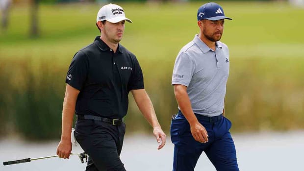 Patrick Cantlay and Xander Schauffele walk during the 2023 Zurich Classic of New Orleans.