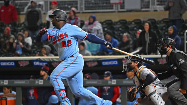 Apr 26, 2022; Minneapolis, Minnesota, USA; Minnesota Twins first baseman Miguel Sano (22) hits a single in the ninth inning against the Detroit Tigers at Target Field.
