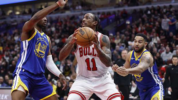 Chicago Bulls forward DeMar DeRozan (11) drives against Golden State Warriors forward Jonathan Kuminga (00) during the second half at United Center. 