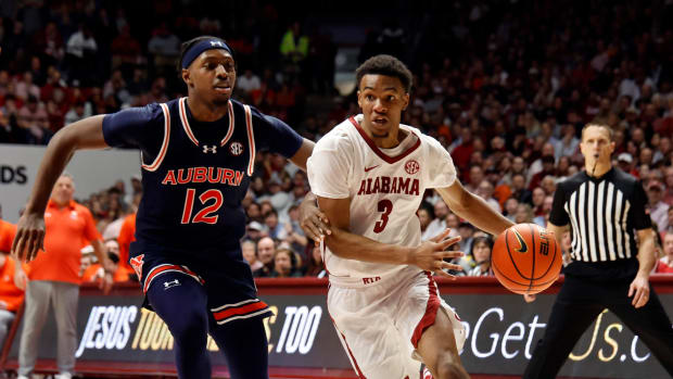 Jan 24, 2024; Tuscaloosa, Alabama, USA; Alabama Crimson Tide guard Rylan Griffen (3) drives to the basket as Auburn Tigers guard Denver Jones (12) defends during the second half at Coleman Coliseum. Mandatory Credit: Butch Dill-USA TODAY Sports  