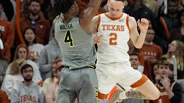 Jan 20, 2024; Austin, Texas, USA; Baylor Bears guard Ja'Kobe Walter (4) shoots over guard Chendall Weaver (2) during the first half at Moody Center. Mandatory Credit: Scott Wachter-USA TODAY Sports