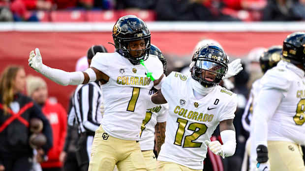Nov 25, 2023; Salt Lake City, Utah, USA; Colorado Buffaloes athlete Travis Hunter (12) and cornerback Cormani McClain (1) react after a call against the Utah Utes at Rice-Eccles Stadium