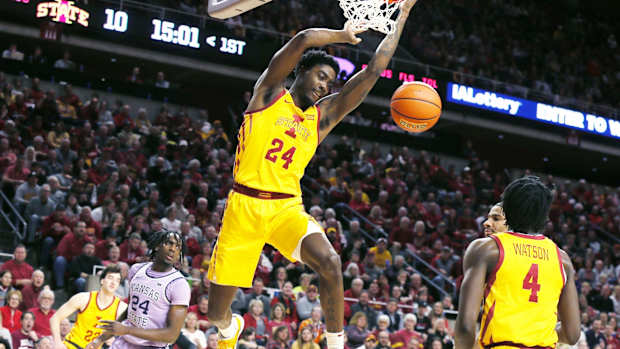 Iowa State Cyclones forward Hason Ward dunks the ball around Kansas State Wildcats forward Arthur Kaluma during a Big 12 game on Jan. 24, 2024, in Ames, Iowa.
