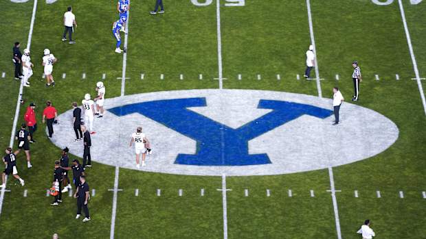 The Cincinnati Bearcats and the Brigham Young Cougars warm up prior to a college football game between the Brigham Young Cougars and the Cincinnati Bearcats, Friday, Sept. 29, 2023, at LaVell Edwards Stadium in Provo, Utah.