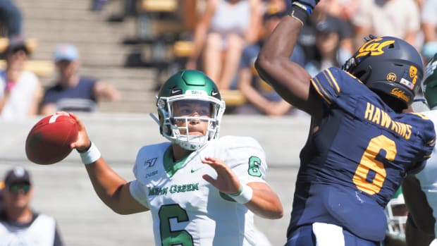 Sep 14, 2019; Berkeley, CA, USA; North Texas Mean Green quarterback Mason Fine (6) looks to throw the ball against California Golden Bears safety Jaylinn Hawkins (6) before fumbling during the first quarter at California Memorial Stadium. Mandatory Credit: Kelley L Cox-USA TODAY Sports  