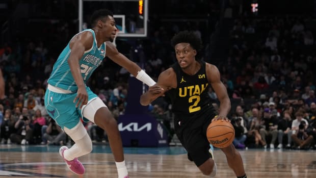 Jan 27, 2024; Charlotte, North Carolina, USA; Utah Jazz guard Collin Sexton (2) handles the ball against Charlotte Hornets forward Brandon Miller (24) during the second half at Spectrum Center. 