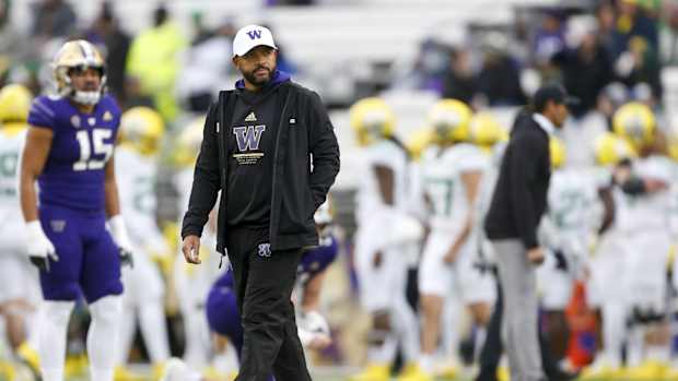 Nov 6, 2021; Seattle, Washington, USA; Washington Huskies head coach Jimmy Lake watches pregame warmups against the Oregon Ducks at Alaska Airlines Field at Husky Stadium.