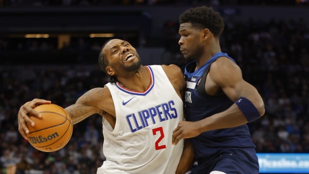 Jan 14, 2024; Minneapolis, Minnesota, USA; Los Angeles Clippers forward Kawhi Leonard (2) works around Minnesota Timberwolves guard Anthony Edwards (5) in the fourth quarter at Target Center.