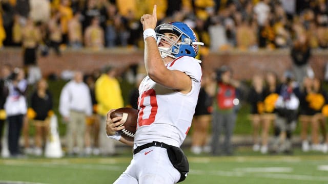 Mississippi Rebels quarterback John Rhys Plumlee (10) celebrates after scoring during the second half against the Missouri Tigers at Memorial Stadium/Faurot Field. Mandatory Credit: Denny Medley-USA TODAY Sports