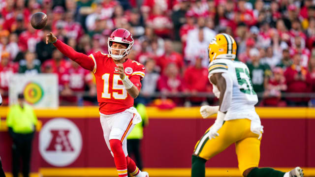 Nov 7, 2021; Kansas City, Missouri, USA; Kansas City Chiefs quarterback Patrick Mahomes (15) throws a pass as Green Bay Packers inside linebacker Krys Barnes (51) defends during the first quarter at GEHA Field at Arrowhead Stadium. Mandatory Credit: Jay Biggerstaff-USA TODAY Sports