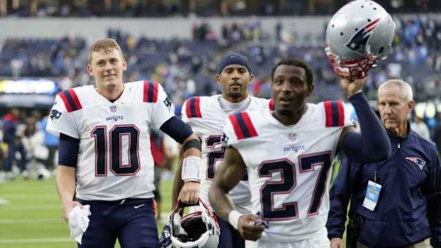 Patriots QB Mac Jones (10) and Cornerback J.C. Jackson (27)