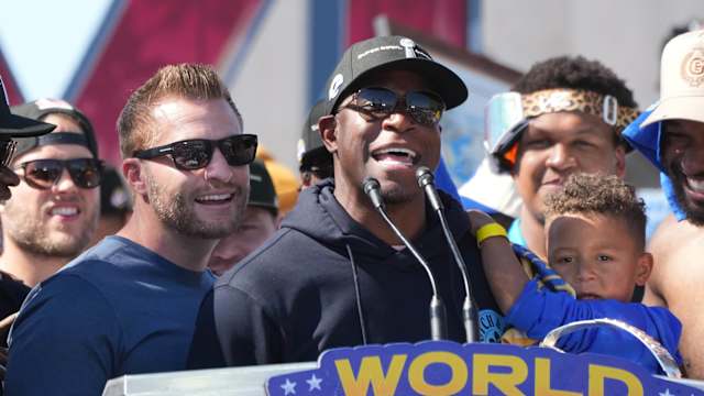 Feb 16, 2022; Los Angeles, CA, USA; Los Angeles Rams coach Sean McVay (left) and defensive coordinator Raheem Morris react during Super Bowl LVI championship rally at the Los Angeles Memorial Coliseum. Mandatory Credit: Kirby Lee-USA TODAY Sports