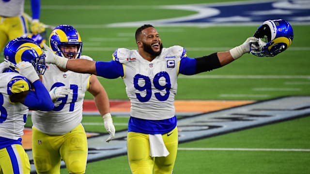 Feb 13, 2022; Inglewood, California, USA; Los Angeles Rams defensive tackle Aaron Donald (99) celebrates after a pressure in the fourth quarter against the Cincinnati Bengals in Super Bowl LVI at SoFi Stadium. Mandatory Credit: Gary A. Vasquez-USA TODAY Sports
